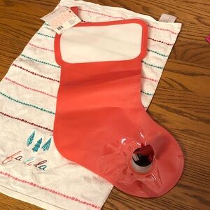 Red Christmas Stocking Wine Dispenser pouch. Perfect white elephant gift